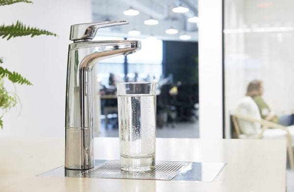 Billi XL Chrome dispenser on font and riser with glass of water