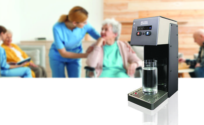 Nurses assisting elderly people at retirement home